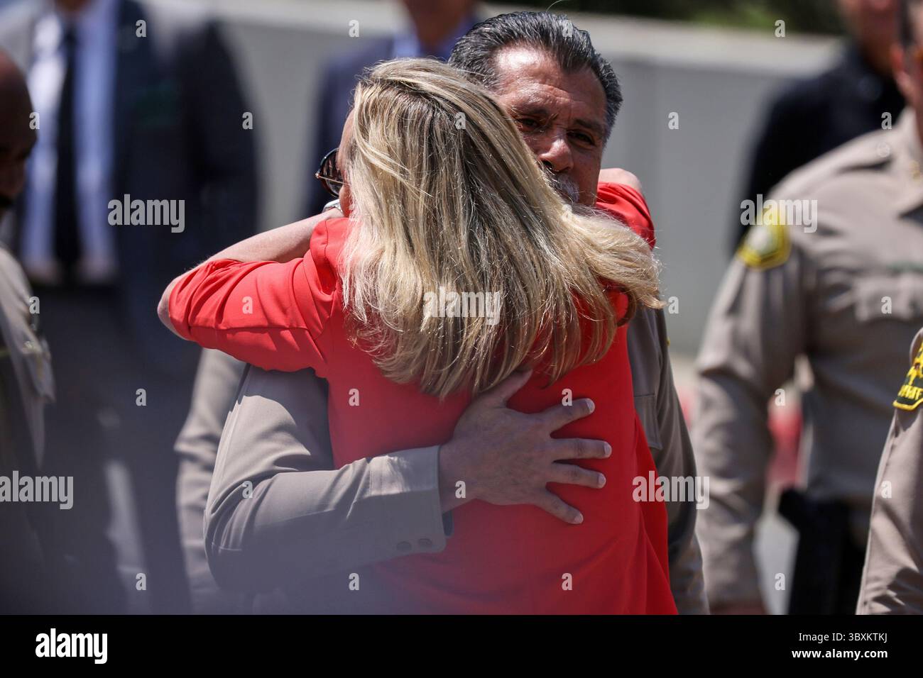Los Angeles County Sheriff Robert Luna gets a hug from Supervisor ...