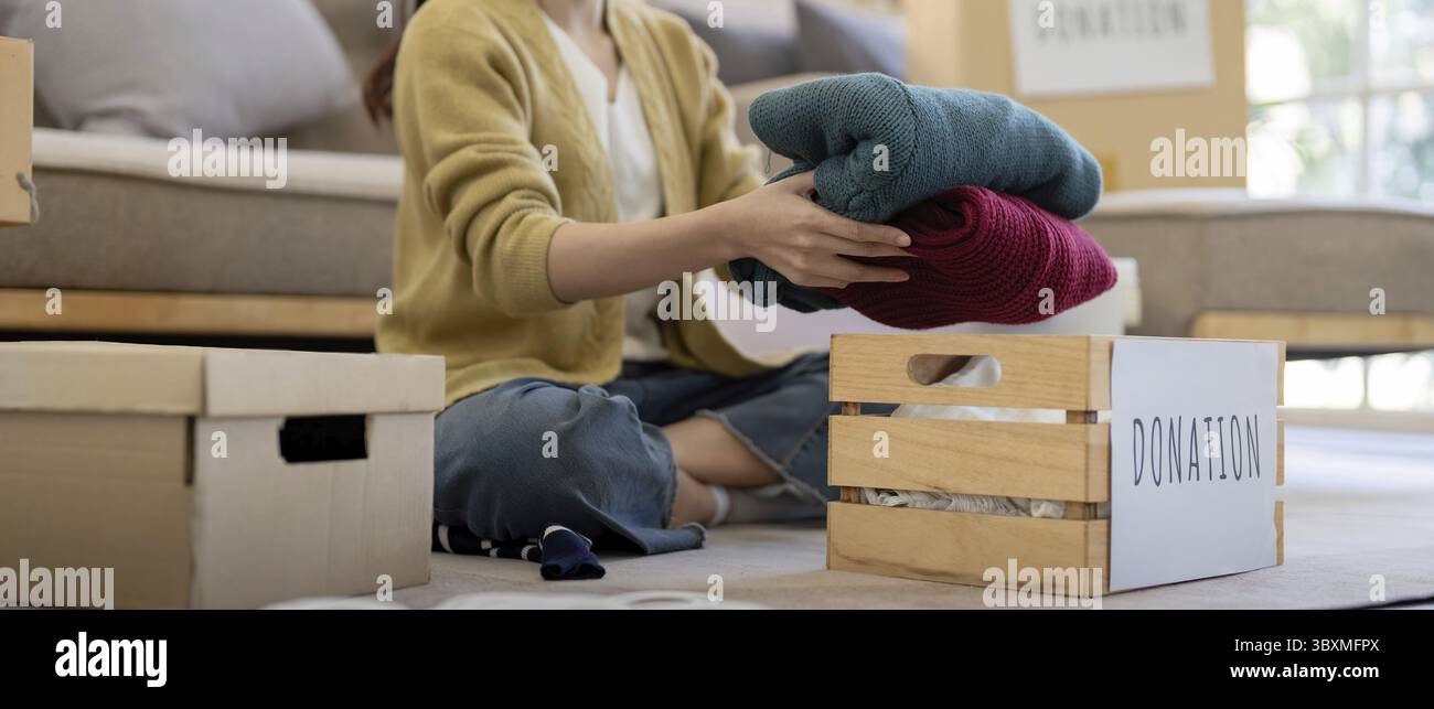 Helping Objects Donation, asian young woman sitting pack object at home, putting on ...