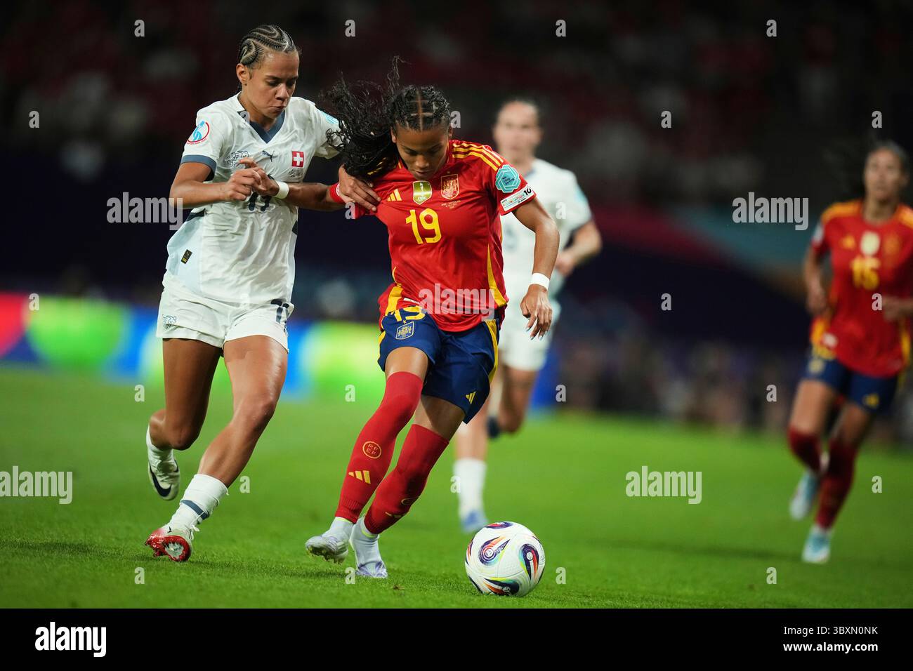 Switzerland’s Iman Beney, left, vies for the ball with Spain’s Vicky