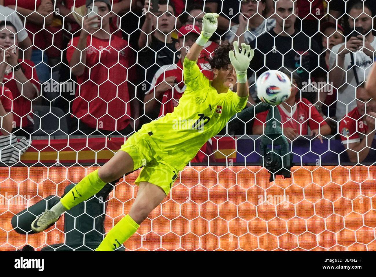 Switzerland goalkeeper Livia Peng saves a penalty from Spain’s Alexia