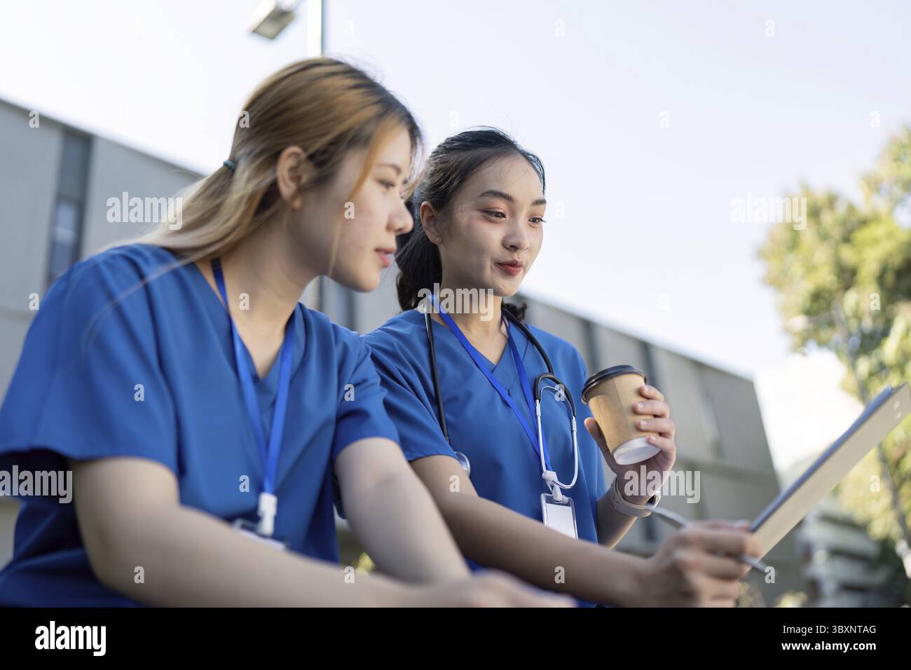Two nurses sitting outside hi-res stock photography and images - Alamy
