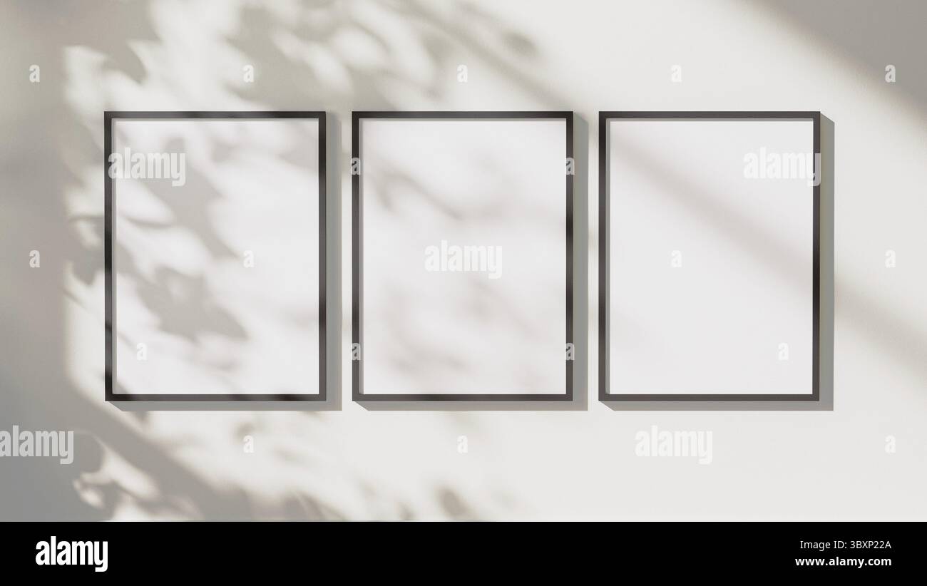 Empty black vertical rectangular frames mock up with leaves shadows and sunlight on white wall background, 3d rendering Stock Photo