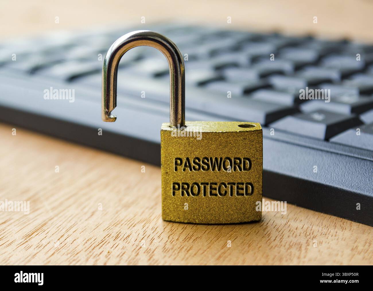 Password protected text engraved on padlock with laptop keyboard background. Password security concept Stock Photo