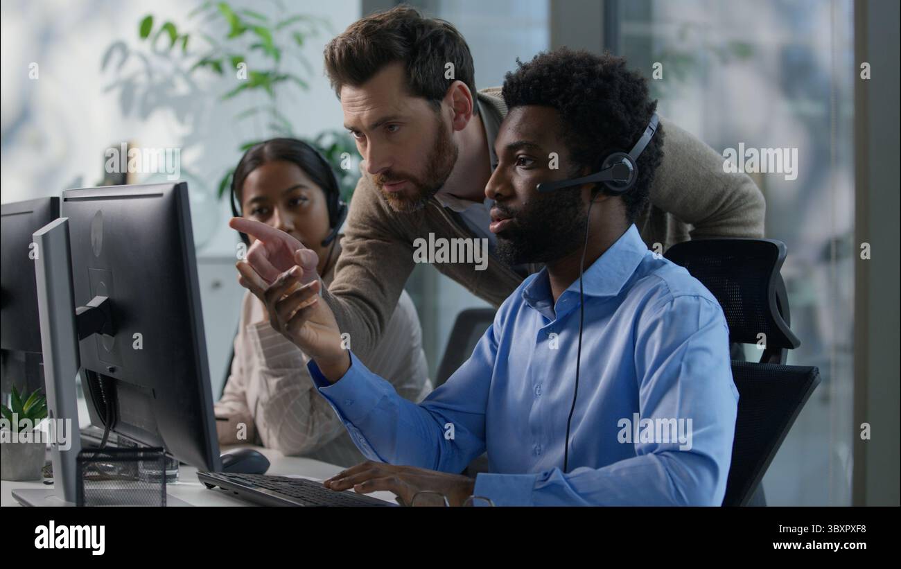 Callcenter Caucasian business boss men explaining African worker ...