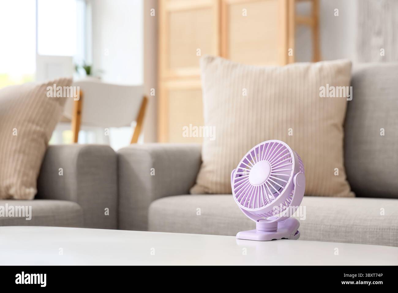 Small electric fan on table Stock Photo