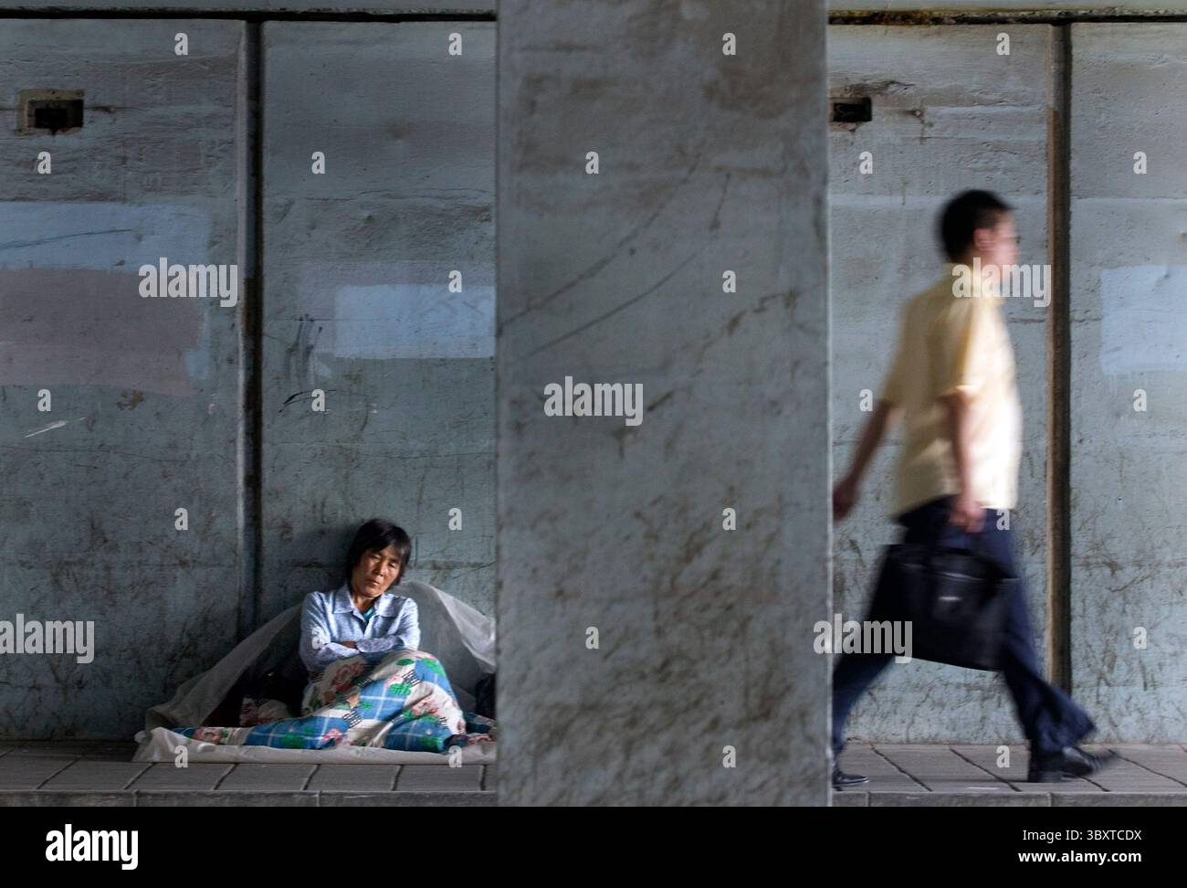 Woman walks under overpass hi-res stock photography and images - Alamy