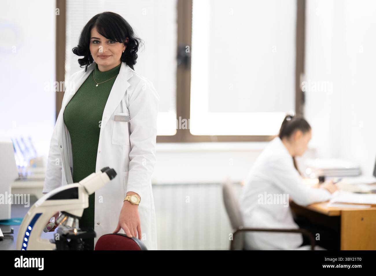 Two female lab technicians working in laboratory Stock Photo