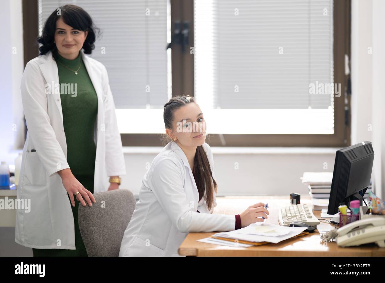 Two female lab technicians working in laboratory Stock Photo