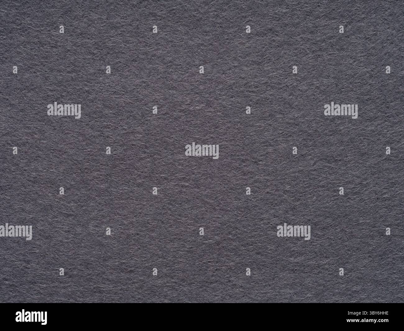 The textured charcoal gray felt. Stock Photo