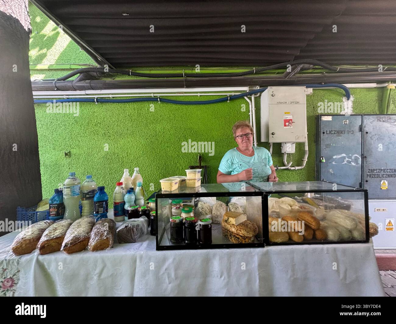 A bread vendor at the farmers market in plac targowy k/ Hali targowej, Krakow, Poland. - Smartphone Captured Stock Image
