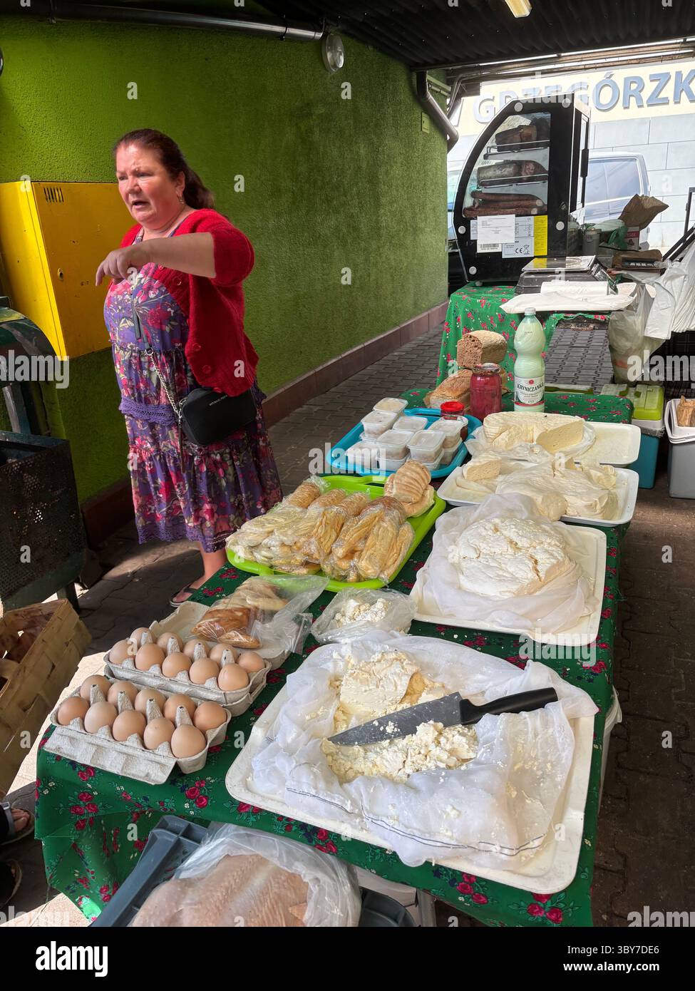 An egg and cheese vendor at the farmers market in plac targowy k/ Hali targowej, Krakow, Poland. - Smartphone Captured Stock Image