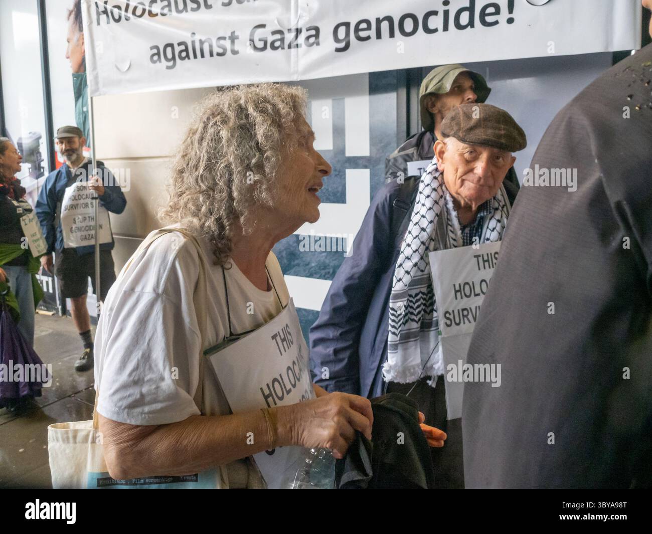London, UK. 19 July 2025. Stephen Kapos and another holocaust survivor on the march. Many thousands march in pouring rain in London demanding an end to the genocide in Gaza where the IDF is targeting people queueing for food and killing 100 people a day as the people starve. They say stop all arms sales to Israel, condemn the plans to force Palestinians into a concentration camp and demand an end to the criminalisation of peaceful protest. Peter Marshall/Alamy Live News Stock Photo