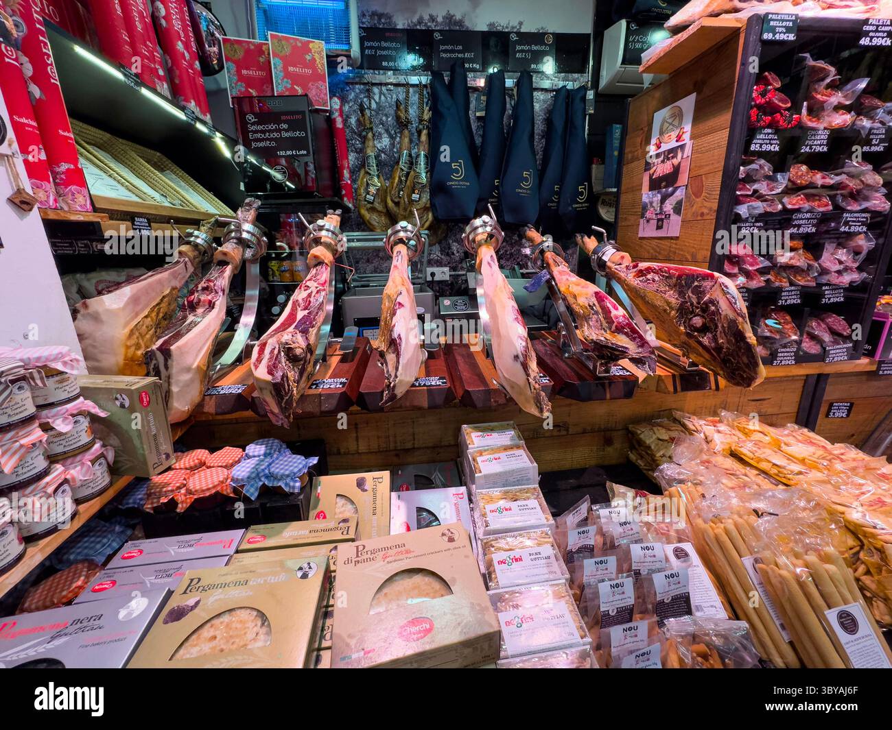 Spanish serrano ham in a shop, Madrid, Spain - Smartphone Captured Stock Image