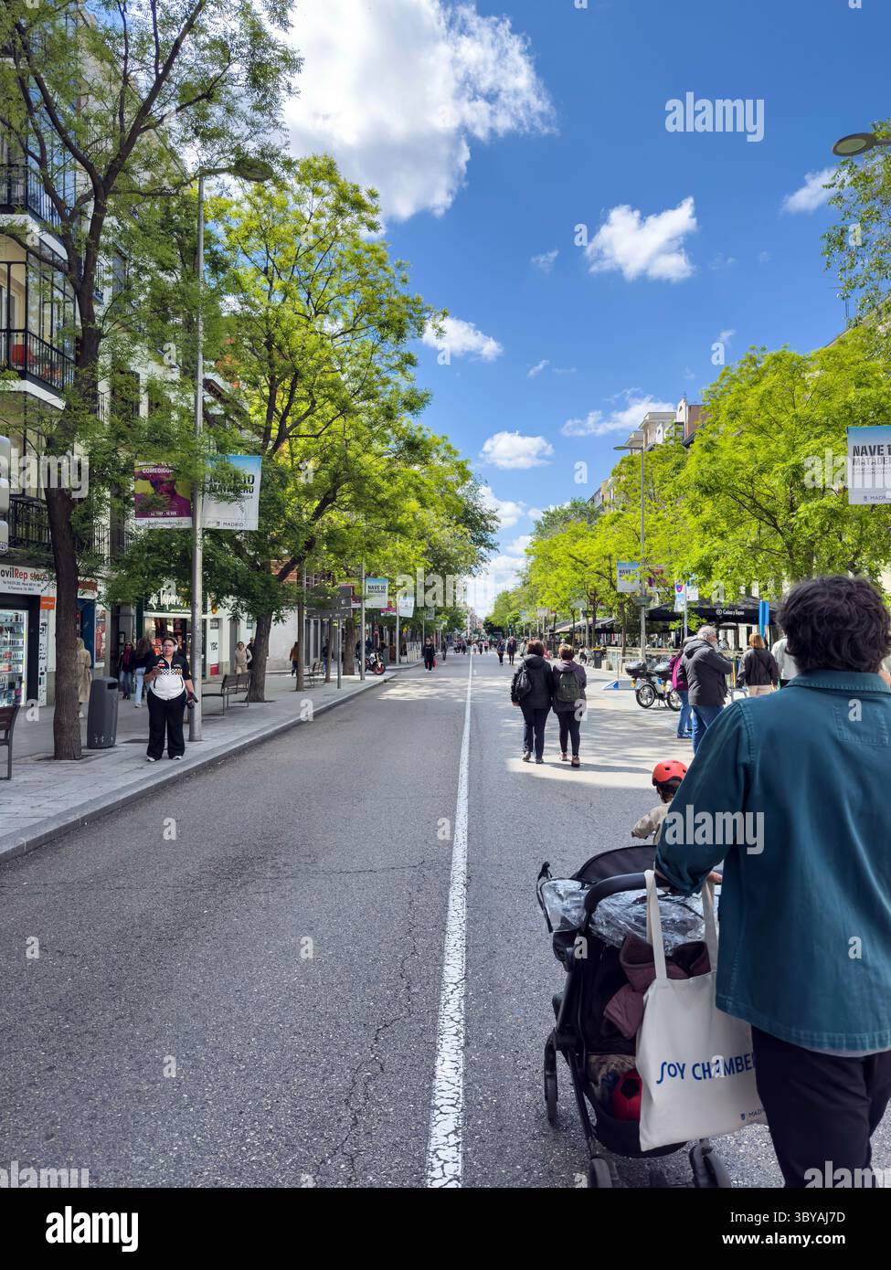 Weekends  in a converted pedestrian street, Calle Fuencarral, Chamberi, Madrid, Spain - Smartphone Captured Stock Image