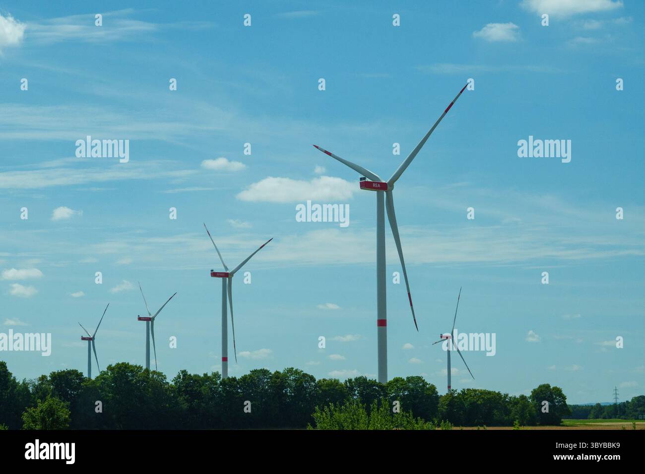Modern wind turbines standing in a rural landscape, generating clean ...