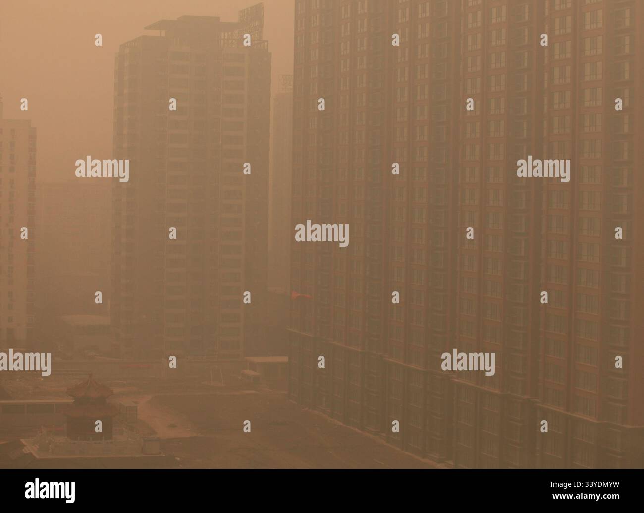 January 18, 2012, BEIJING, CHINA: New housing estates under construction are veiled by thick smog, which the U.S. Embassy's daily air index has rated as hazardous, blanketing Beijing January 18, 2012.  Air pollution in China's capital has been so bad that the air quality monitoring system used by the U.S. Embassy here has described the pollution as being off the scale. The World Bank reports that 16 of the 20 most polluted cities in the world are in China, with Beijing being the 10th most polluted capital. (Credit Image: © Stephen Shaver/ZUMA Press Wire) Stock Photo
