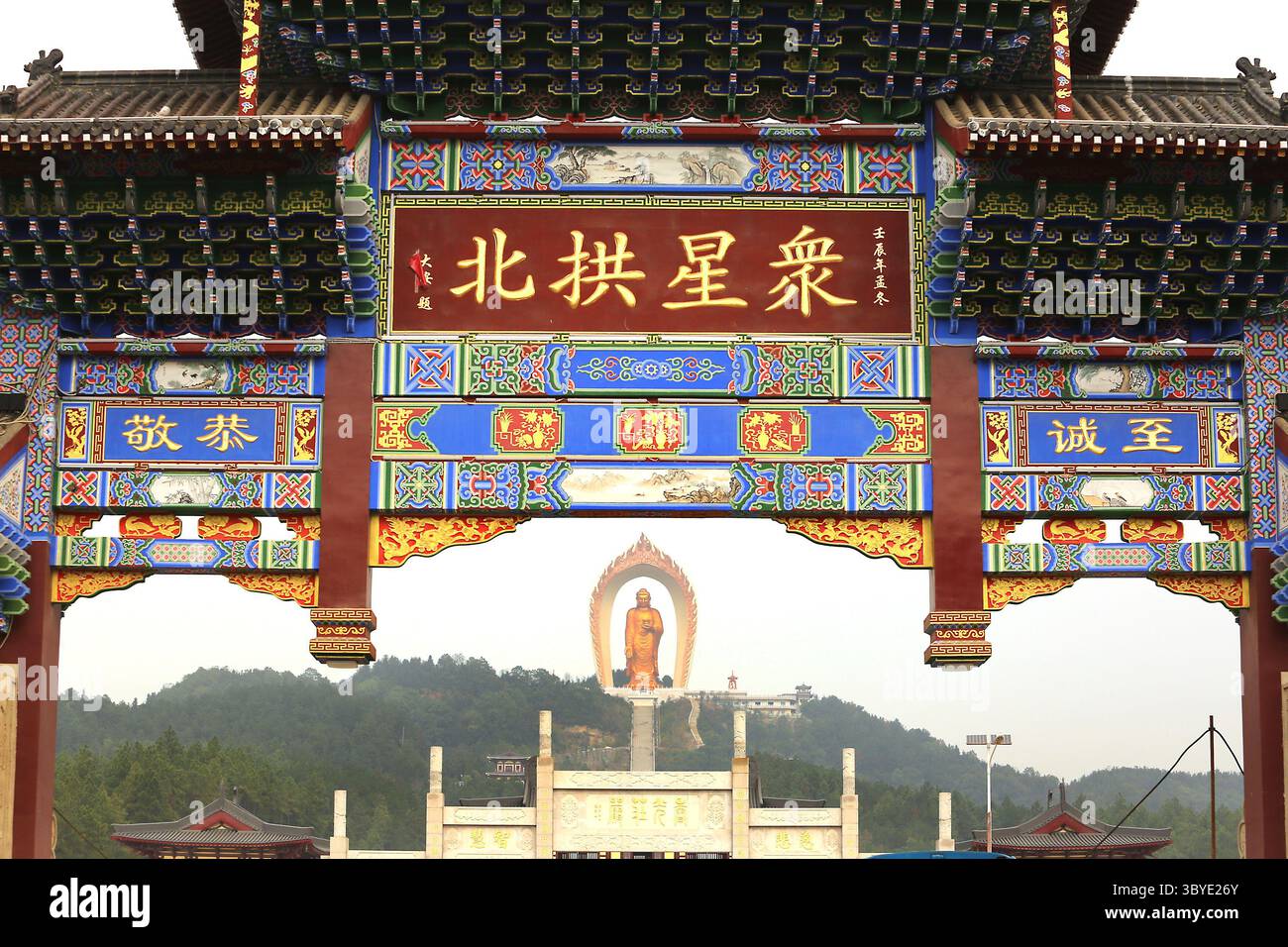November 19, 2014, WENQUAN, JIANGXI PROVINCE, CHINA: Chinese tourists visit the Donglin Buddha, located in the foothills of Lushan Mountain in east China's Jiangxi Province, on November 19, 2014.  The Buddha statue is  the world's highest Amitabha statue, according to the government.  China has slowly, but positively embraced ecotourism as unchecked development across the country has begun threatening cultural heritage areas and the traditional ways of life in ethnic-rich provinces. (Credit Image: © Stephen Shaver/ZUMA Press Wire) Stock Photo
