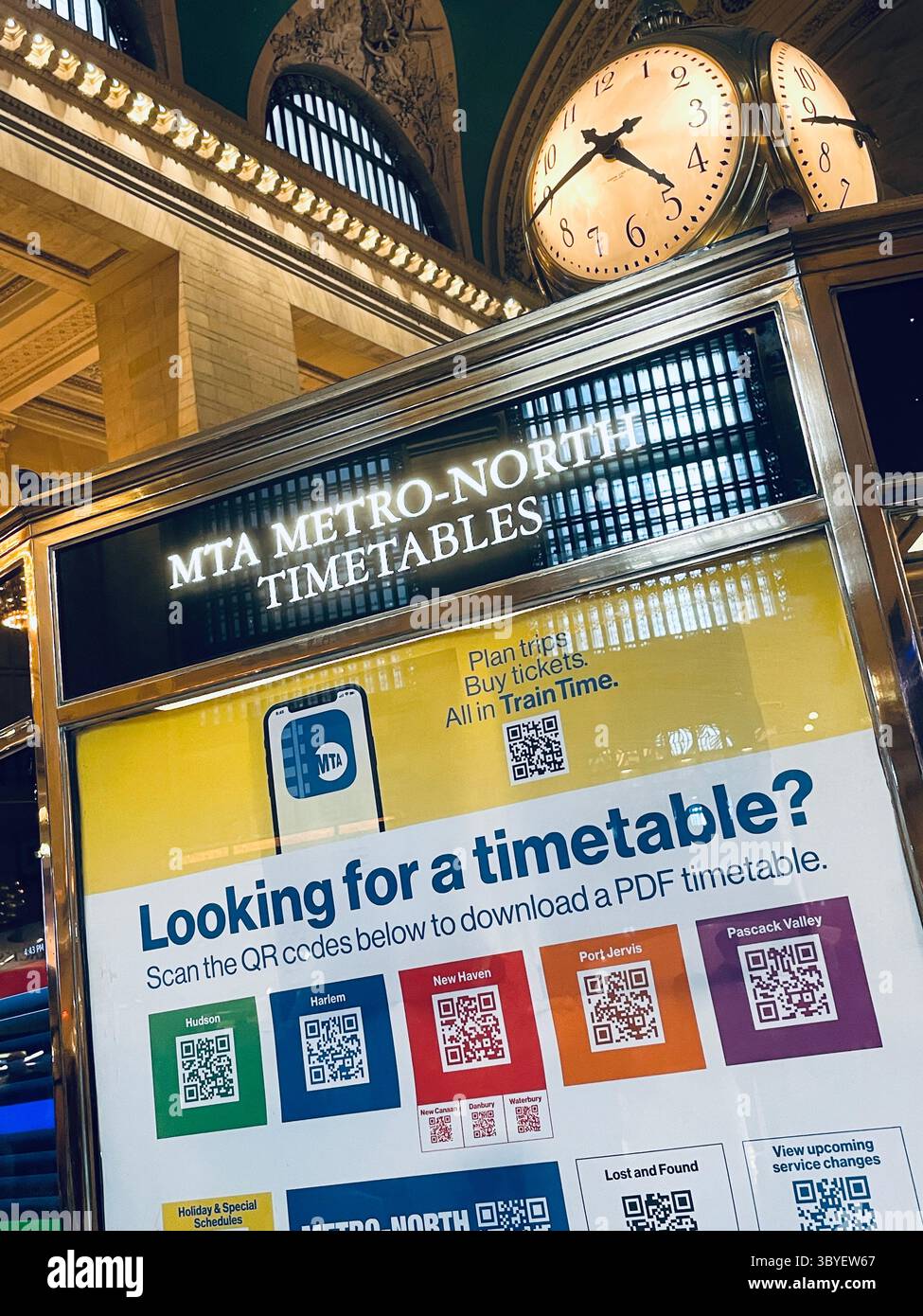 The information kiosk in Grand Central's grand concourse is topped by the iconic clock, 2025, New York City, USA - Smartphone Captured Stock Image