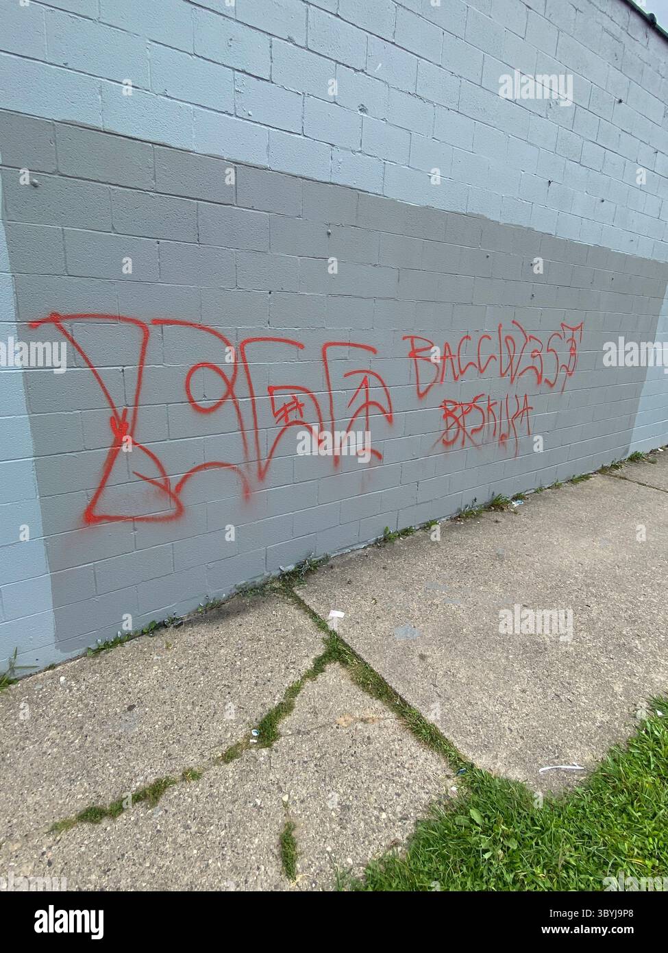 W7M ScoreGang graffiti. Crip set known for street-level disputes, petty crime, and extensive graffiti tagging in Detroit's Five Points neighborhood. - Smartphone Captured Stock Image