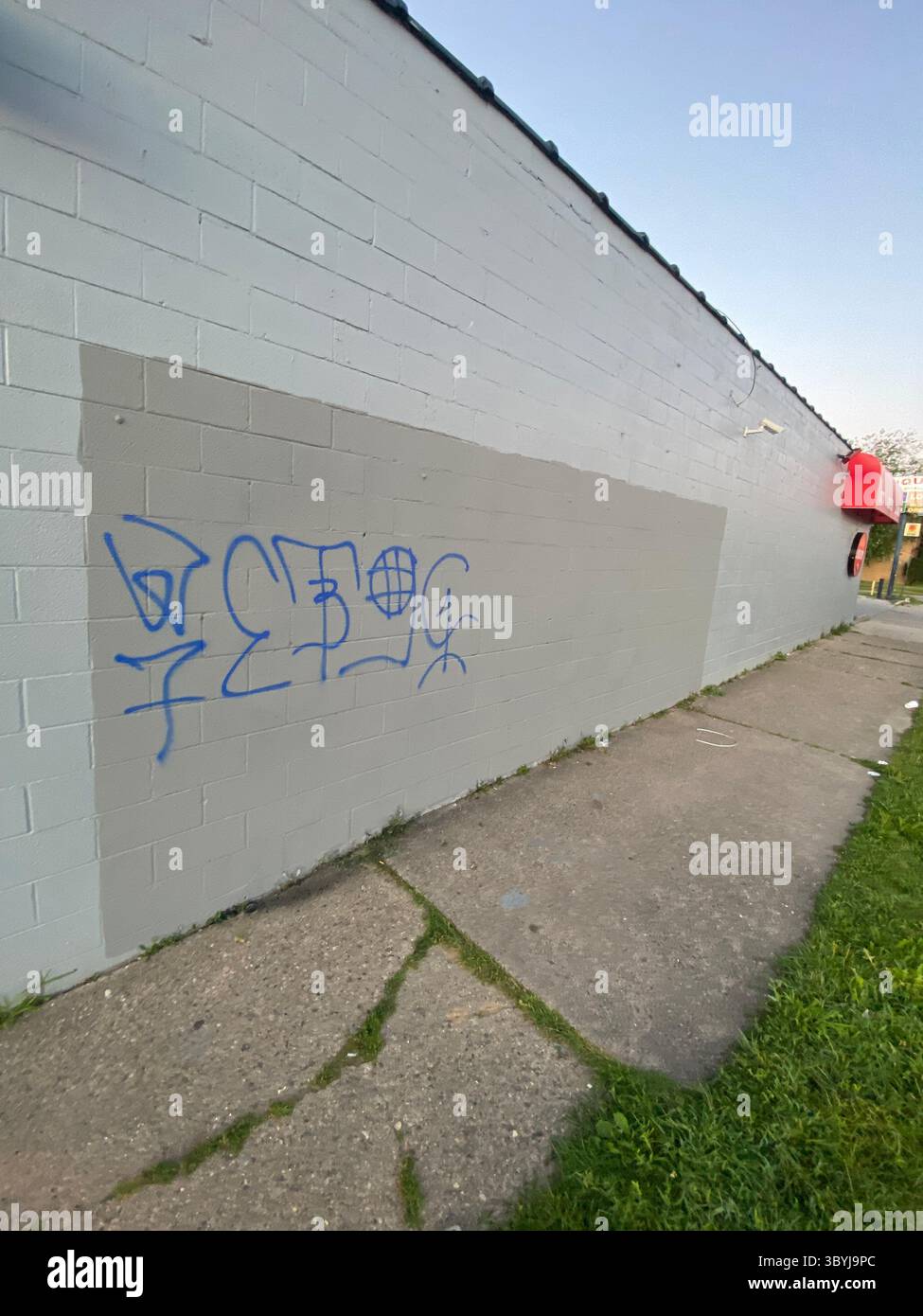 W7M ScoreGang graffiti. Crip set known for street-level disputes, petty crime, and extensive graffiti tagging in Detroit's Five Points neighborhood. - Smartphone Captured Stock Image