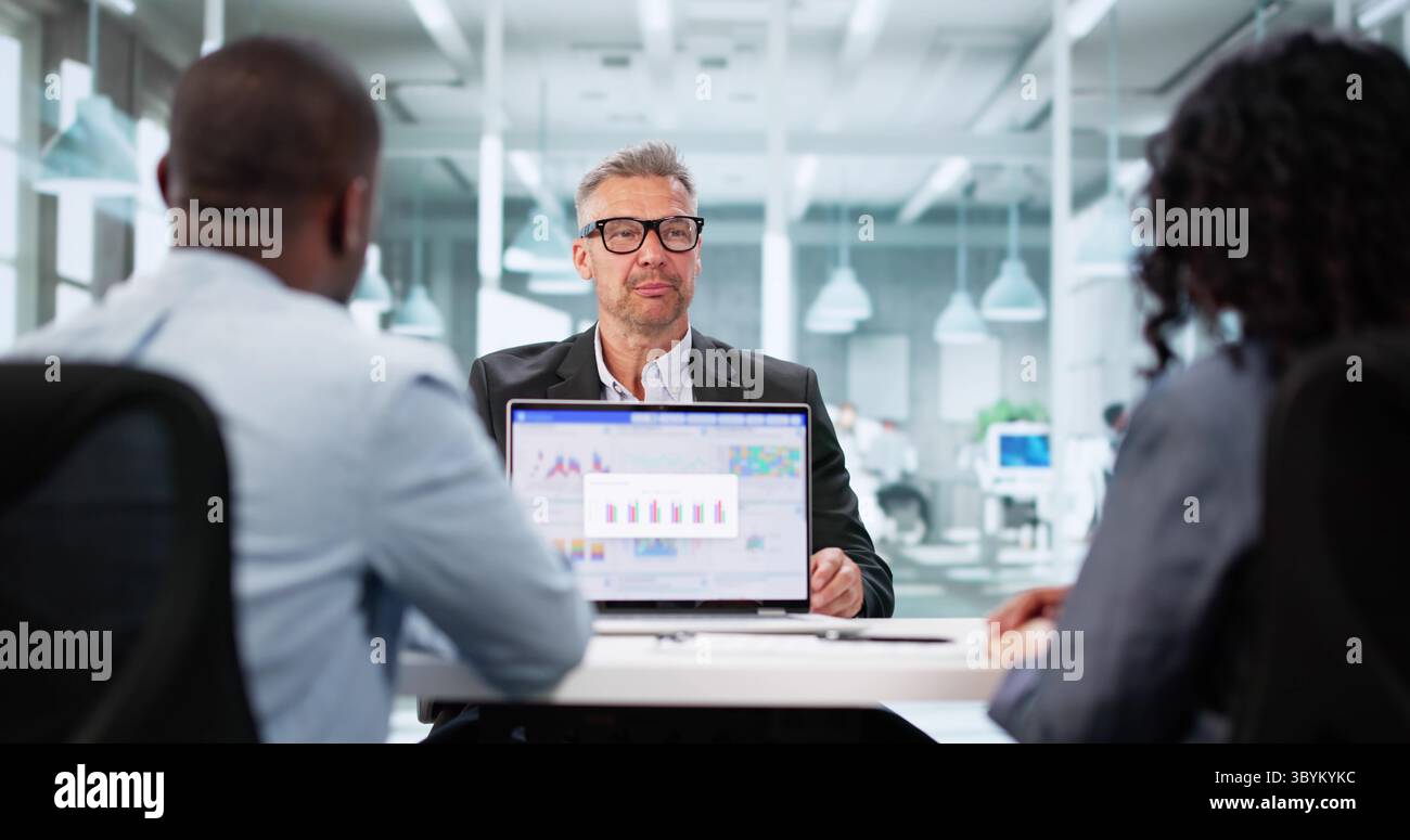 Financial Advisor Meeting With Client For Tax Planning Advice Depicts A Meeting Between An Accountant And Client Stock Photo