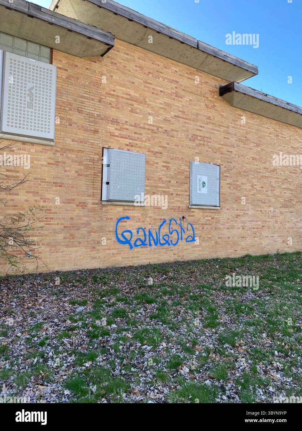 ScoreGang, Detroit Crips subset, ‘GANGSTA’ graffiti tag in blue paint, Five Points Detroit, ‘Gangsta’ denotes Crips descriptor. - Smartphone Captured Stock Image