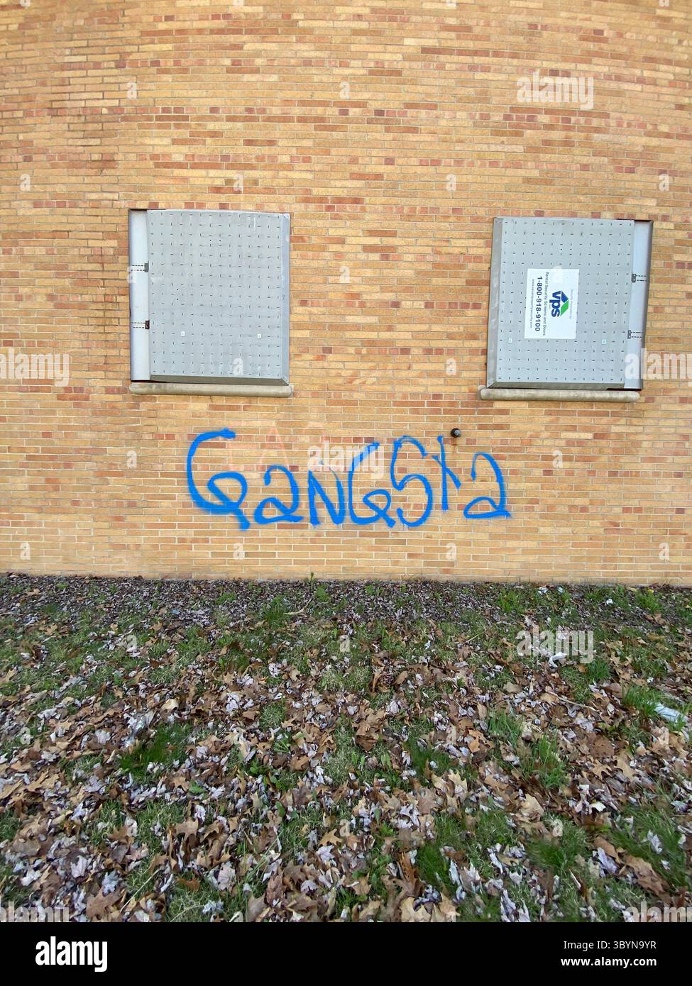 ScoreGang, Detroit Crips subset, ‘GANGSTA’ graffiti tag in blue paint, Five Points Detroit, ‘Gangsta’ denotes Crips descriptor. - Smartphone Captured Stock Image