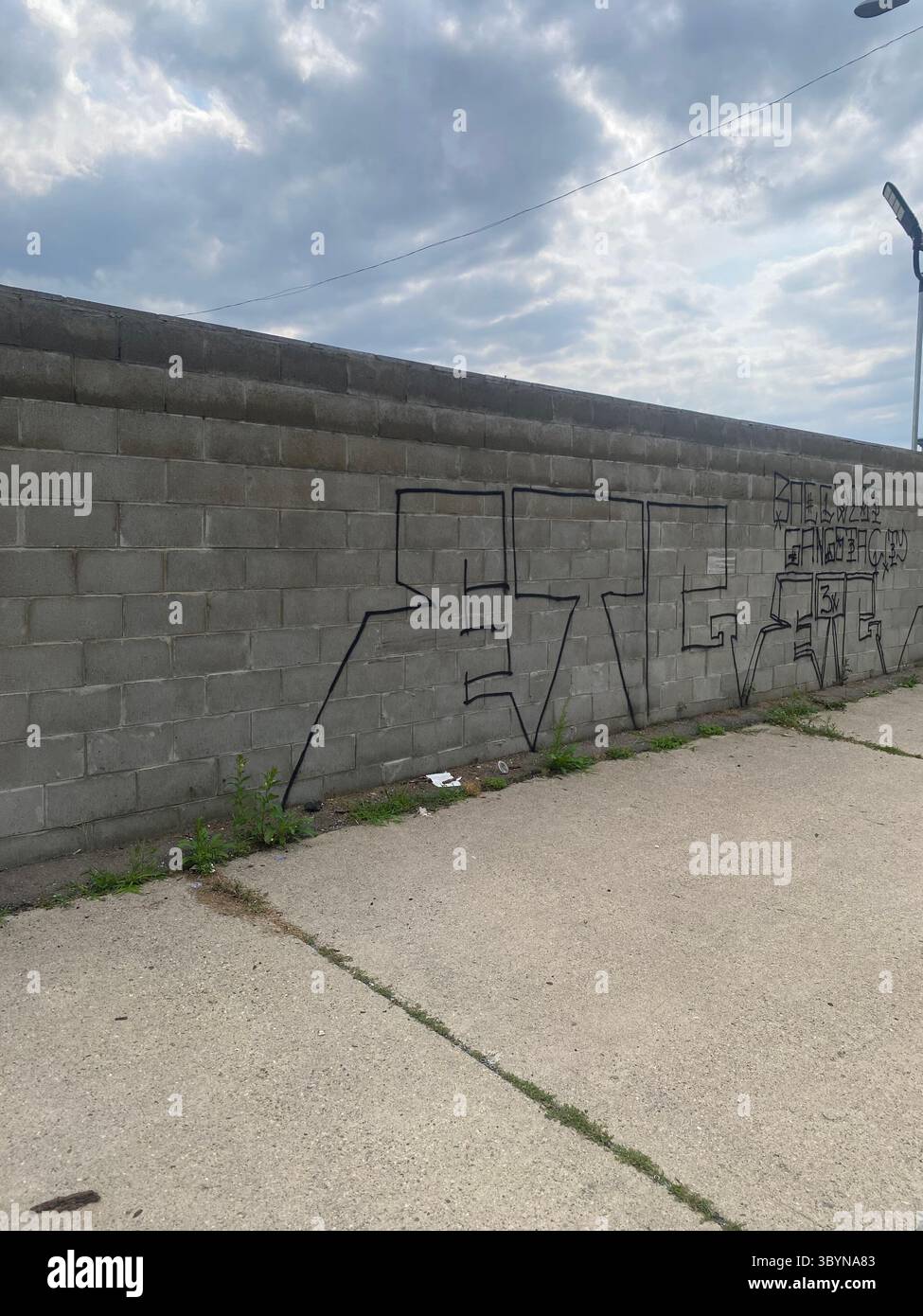 5PN is a Detroit street gang alliance of smaller Crip cliques and tag crews in 48219 (Five Points), including W7M, ScoreGang, ETGC, and more. - Smartphone Captured Stock Image