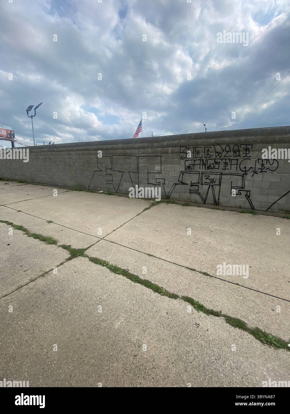 5PN is a Detroit street gang alliance of smaller Crip cliques and tag crews in 48219 (Five Points), including W7M, ScoreGang, ETGC, and more. - Smartphone Captured Stock Image