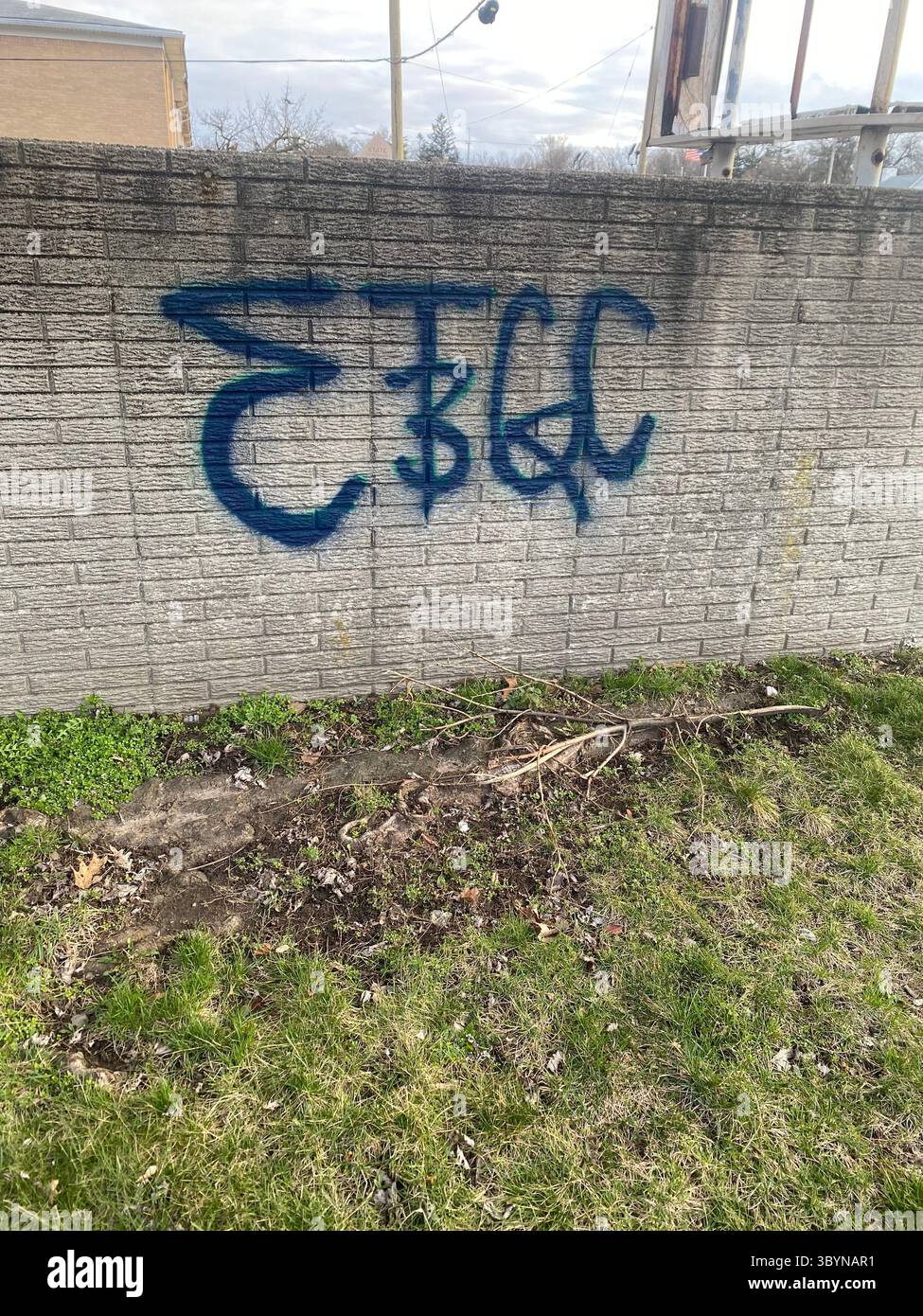 W7M Crips vs RR$C (Rollin’ 60s Crips) tag wars, graffiti cross-outs on Appleton St near West Seven Mile Rd, northwest Detroit (48219) - Smartphone Captured Stock Image