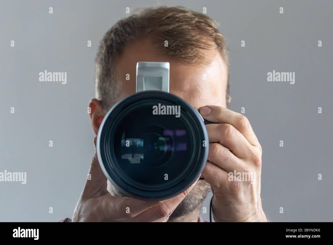 Man taking a photo in a mirror. Stock Photo