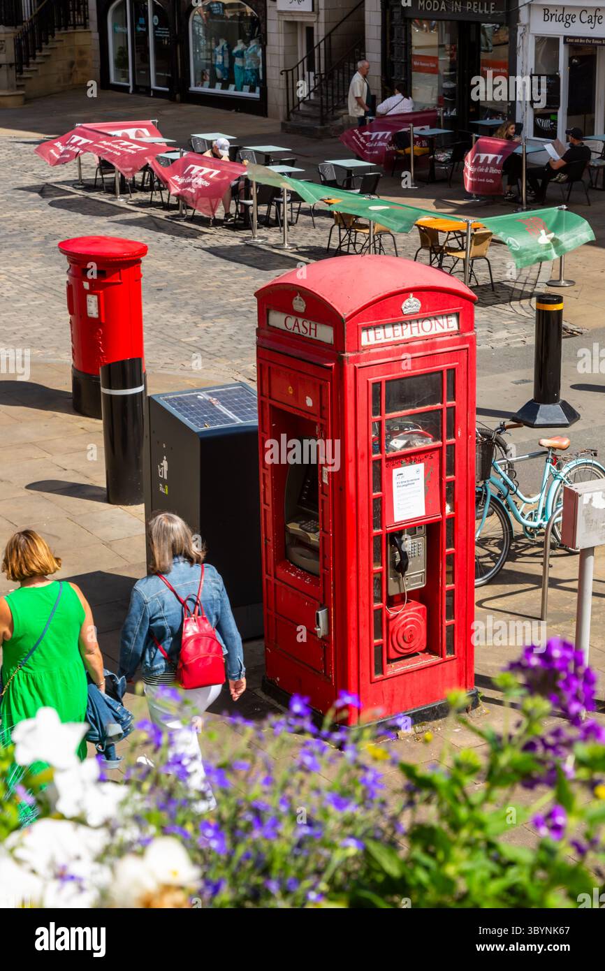 Traditional red telephone kiosk and Royal Mail posting box. UK. 2025 Stock Photo