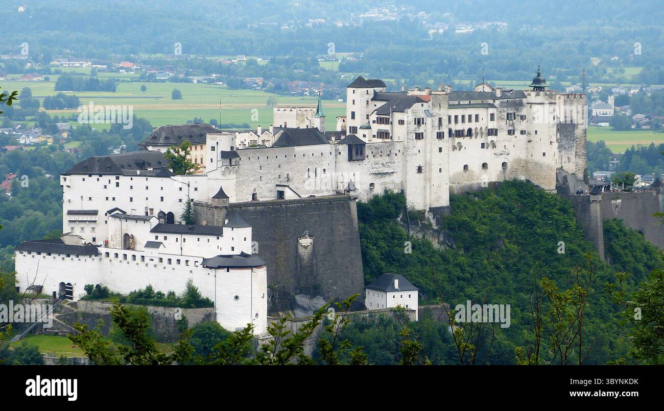 Salzburg, Austria – June 27, 2013. View of 900-year-old cliff top Festnung Hohensalzburg fortress in Salzburg. The large medieval fortress sits atop t Stock Photo