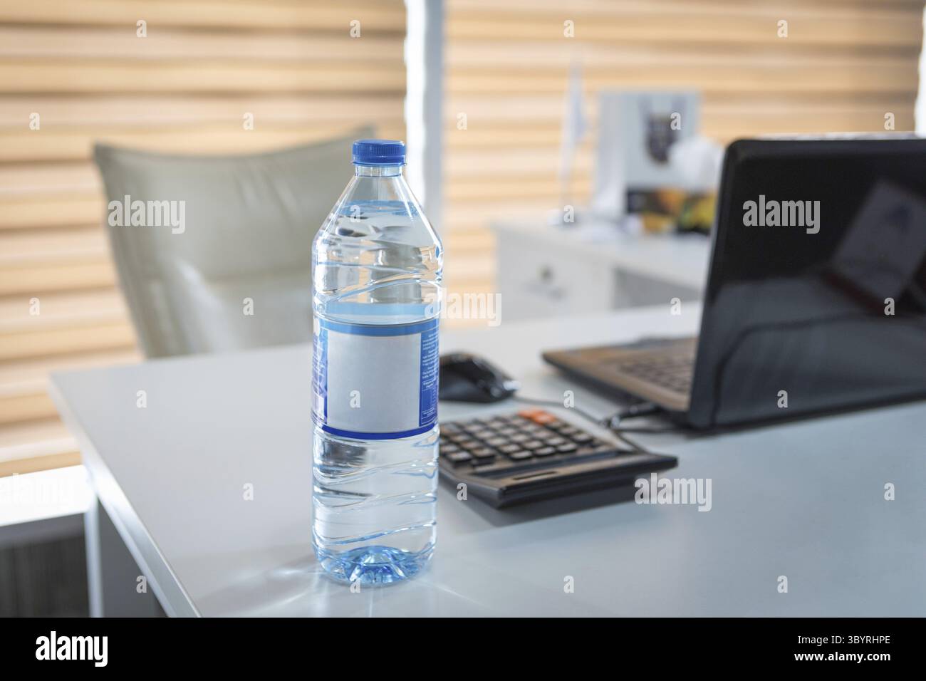 Plastic water bottle on the office desk Stock Photo