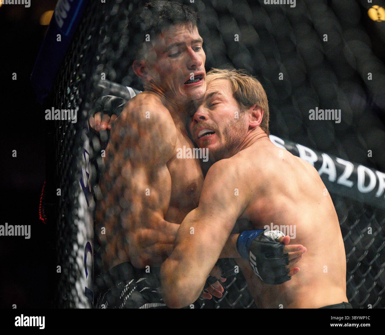Adam Fugitt right, hits Islam Dulatov in an early prelim welterweight ...