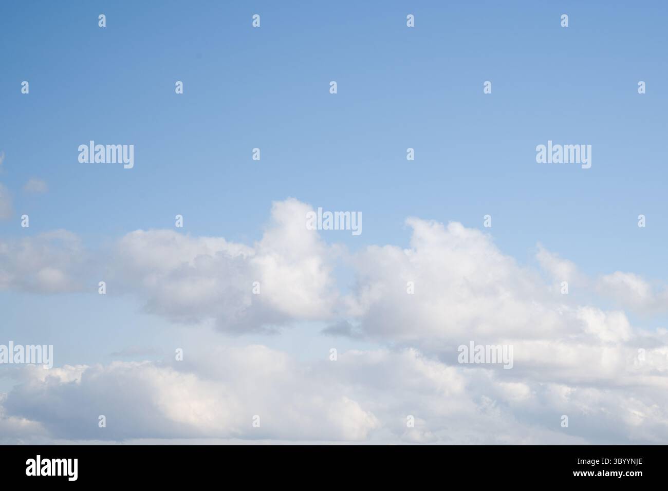 Blue Sky with Scattered White Clouds Stock Photo