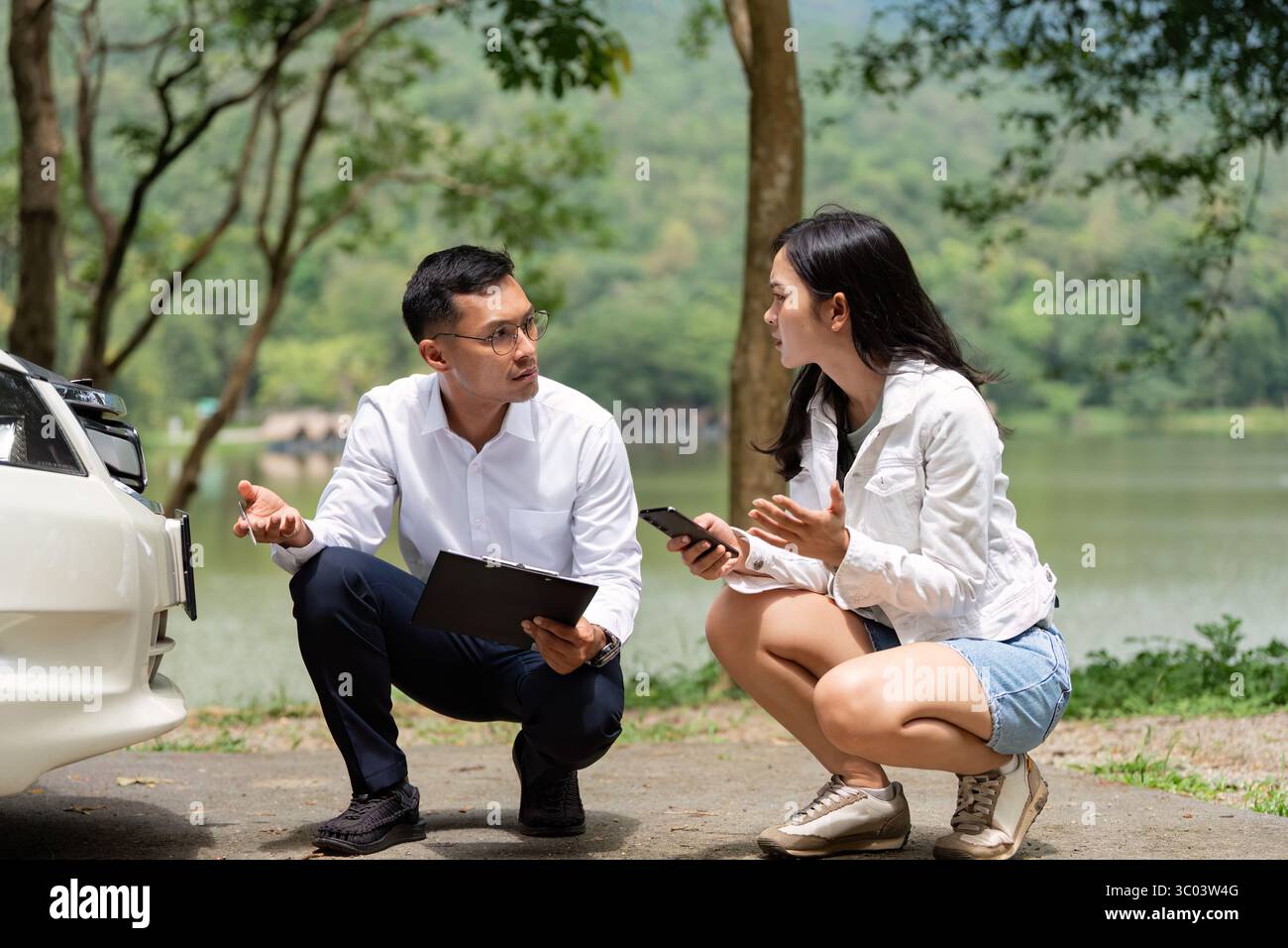 Insurance Discussion. Mechanic and client conversing about vehicle ...