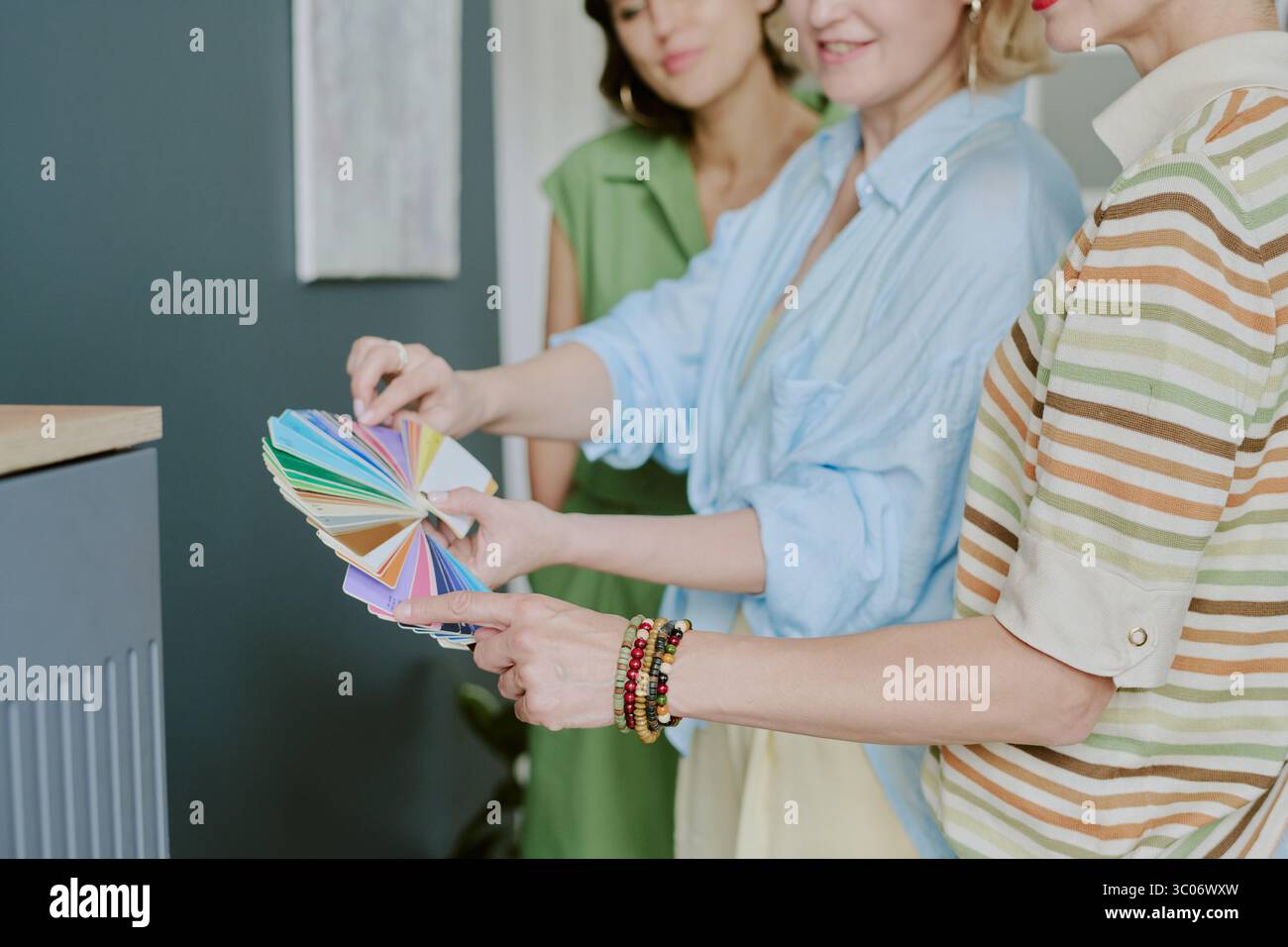 Group of Caucasian Women Selecting Color Swatches Together Stock Photo