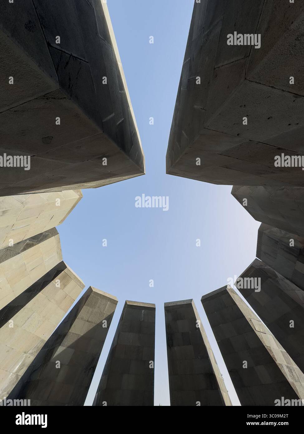 A large building with a circular opening in the middle. The building is ...