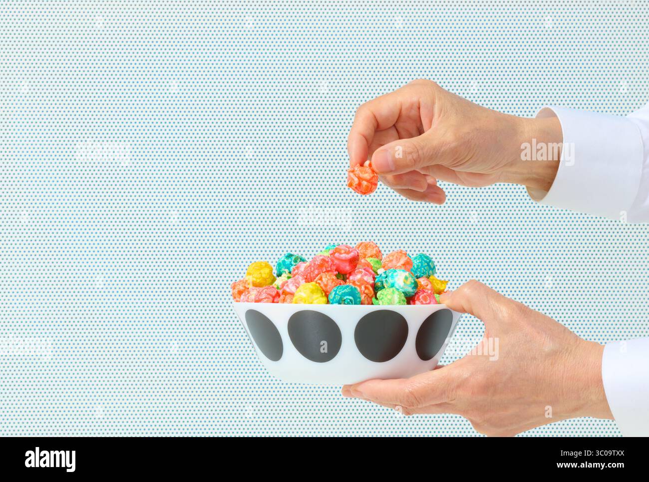 Caramel Corn with Hand Lifting on White Background Stock Photo