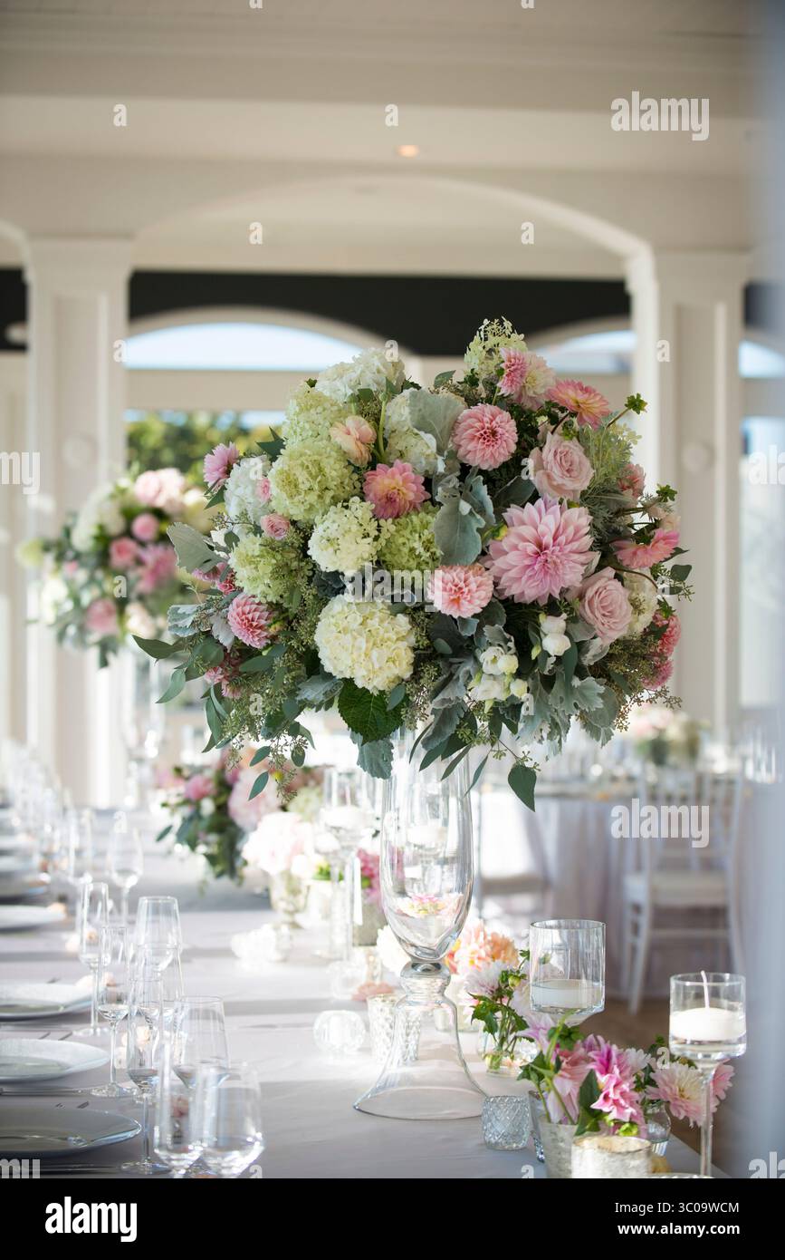 Tall Wedding Centerpiece with Pastel Flowers in Elegant Receptio Stock Photo