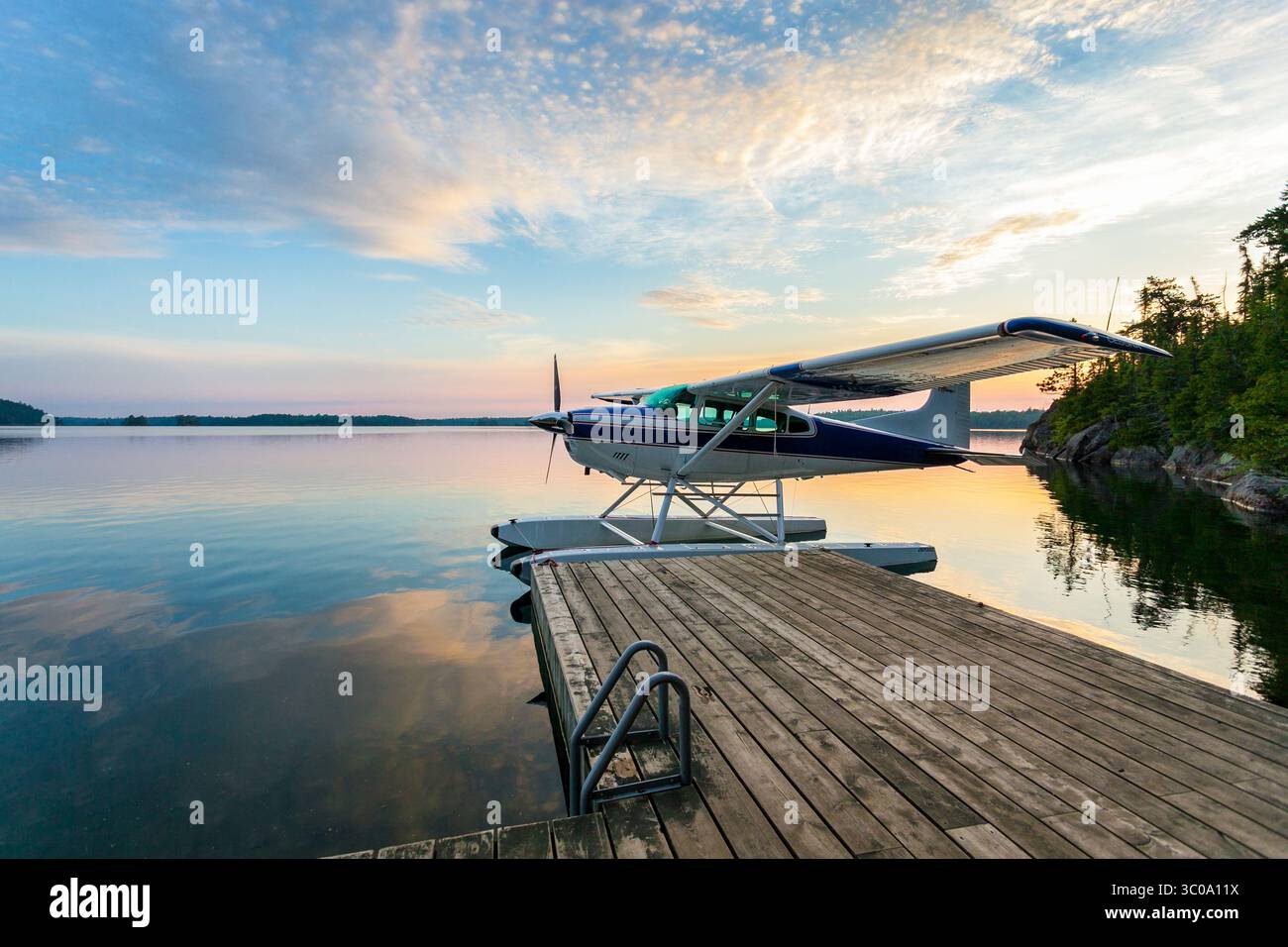 A float plane at dawn on Lake Temagami in northern Ontario Stock Photo