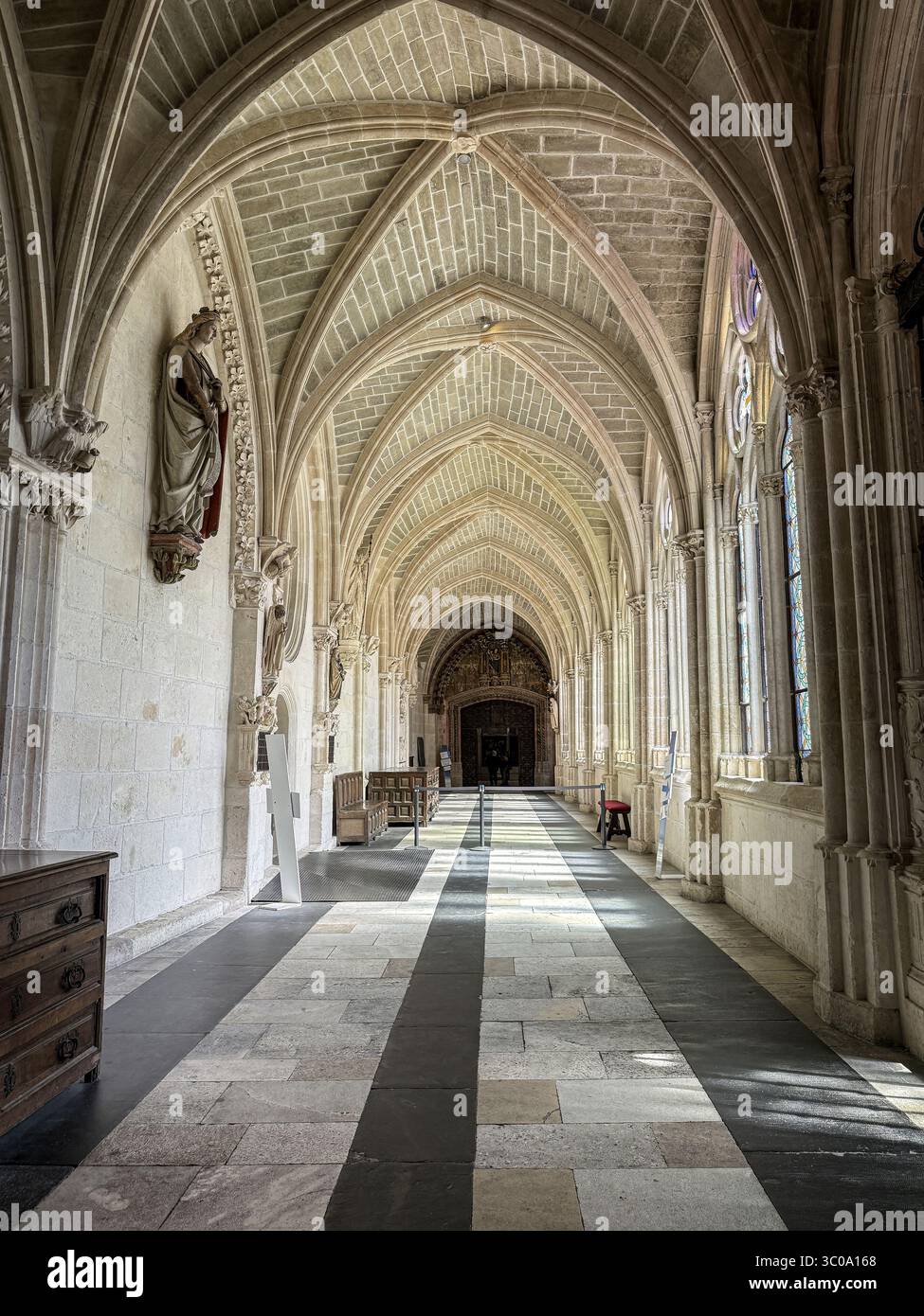 Gothic vaulted cloister gallery with stained glass and medieval ...
