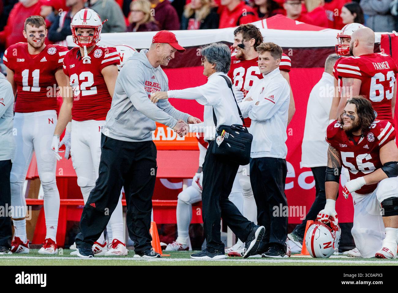 October 20, 2018 - Lincoln, NE. U.S. - Nebraska Cornhuskers head coach Scott Frost hugs assistant coach Mario Verduzco near the end of a NCAA Division 1 football game between Minnesota Golden Gophers and the Nebraska Cornhuskers at Memorial Stadium in Lincoln, NE. .Attendance: 89,272.Nebraska won 53-28.Michael Spomer/Cal Sport Media(Credit Image: &copy; Michael Spomer/CSM via ZUMA Wire) Stock Photo