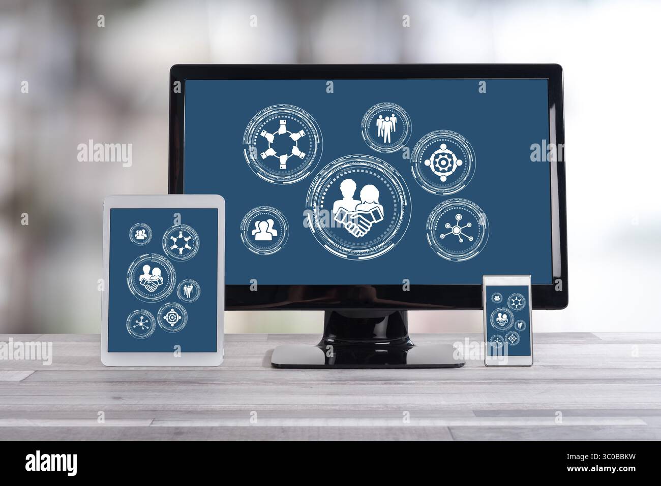 Collaboration concept shown on different information technology devices Stock Photo