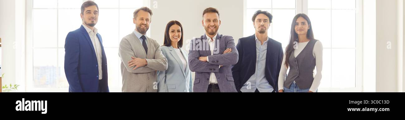 Group portrait of successful smiling business team posing in office ...