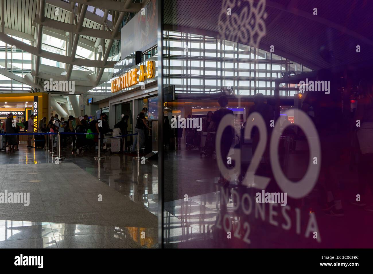 Bali, Jul 20 2025: Passengers queue at departure gate during G20 Indonesia 2022 event at I Gusti Ngurah Rai International Airport. Stock Photo