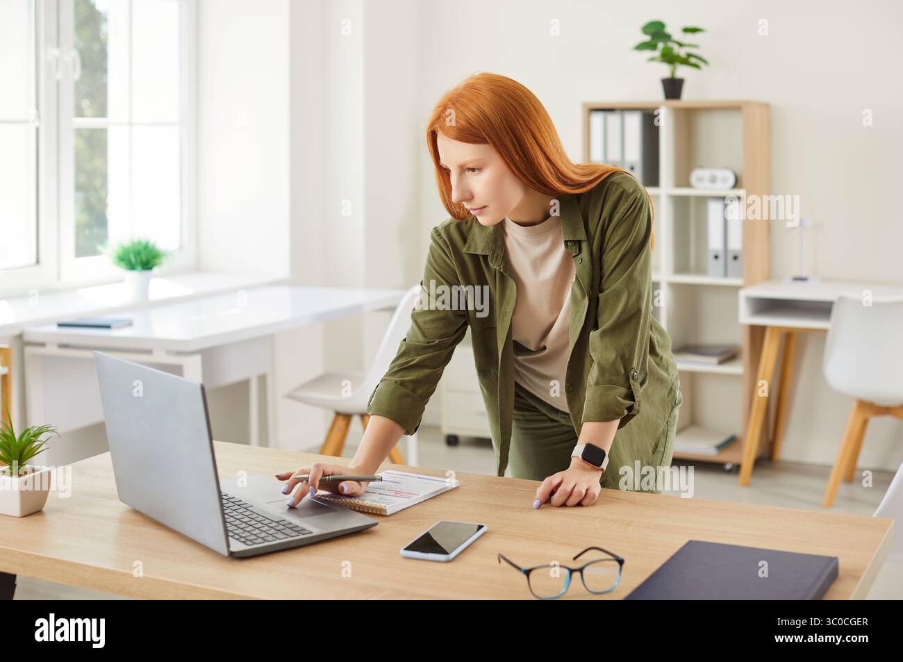 Woman Working Or Studying Online From Her Home Office Stock Photo