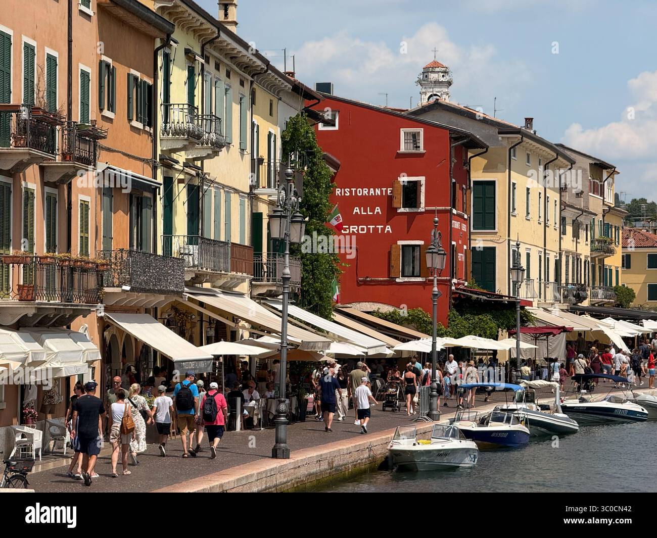 The lake front and harbour on a busy day at Lazise, Lake Garda, Italy - Smartphone Captured Stock Image