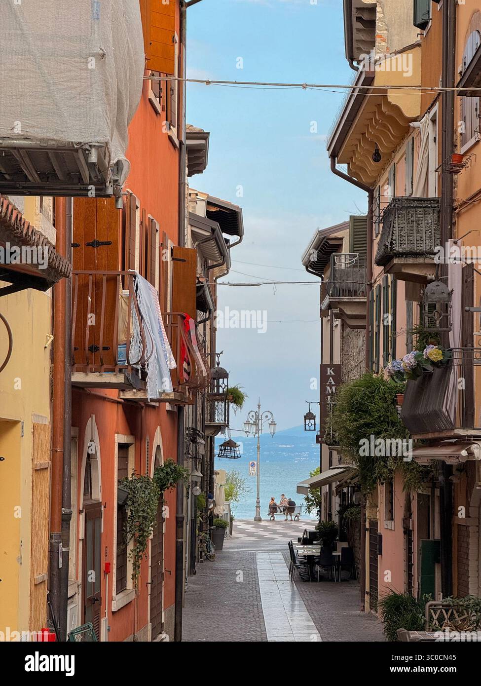 Street in Lazise looking towards the lake early in the morning. Lake Garda, Italy - Smartphone Captured Stock Image